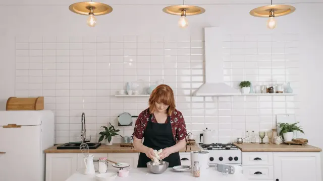 Dog owner preparing a meal