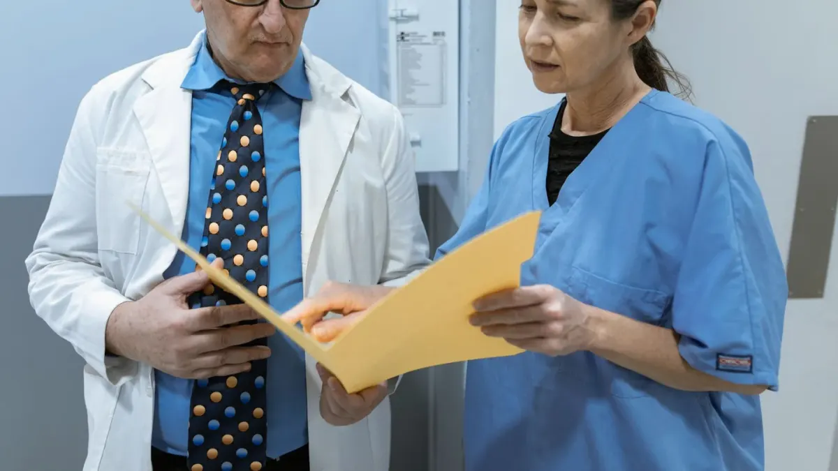 Veterinarian and dog owner reviewing a supplement label together in an exam room
